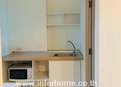 Small kitchenette with microwave and sink