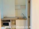 Small kitchenette with microwave and sink