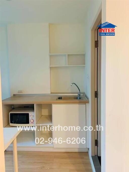 Small kitchenette with microwave and sink