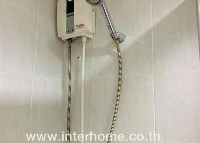 Bathroom with wall-mounted electric water heater
