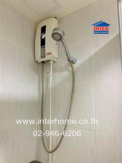 Bathroom with wall-mounted electric water heater