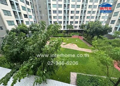View of residential building with shared garden area