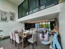 Modern living room with dining area and high ceilings