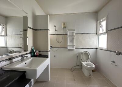 Modern bathroom with large sink and toilet