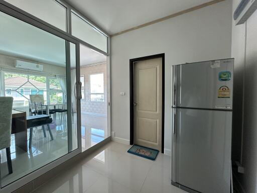 Modern kitchen area with adjacent dining room