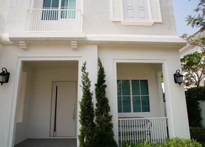 Exterior view of a two-story house with front porch