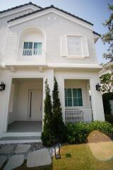 Exterior view of a two-story house with front porch