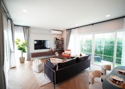 Modern living room with large windows and contemporary furniture