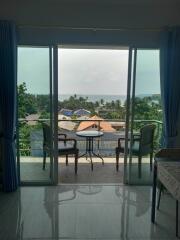 Living space with balcony and sea view