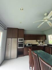 Modern kitchen with appliances and dining area