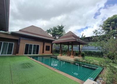 A beautiful backyard with a gazebo and swimming pool
