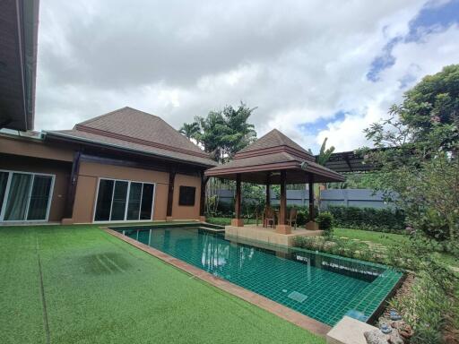 A beautiful backyard with a gazebo and swimming pool