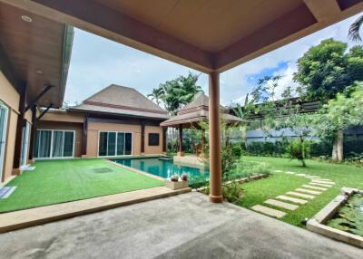 Outdoor space with pool and garden