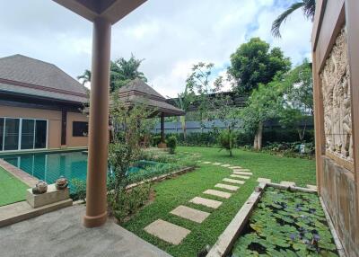 Outdoor garden view with pool and walkway