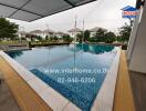 Outdoor swimming pool with tiled flooring and seating area
