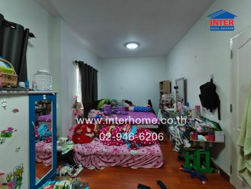 Bedroom with scattered furniture and children