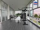 Gym with exercise equipment and large windows