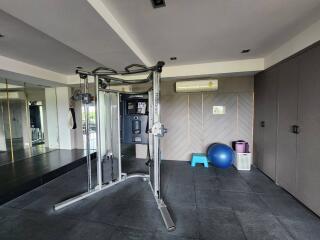 Modern home gym with equipment and mirrors