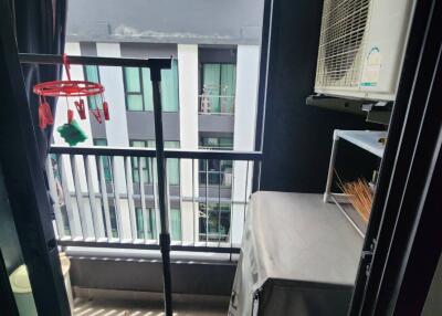 A small balcony with apartment view