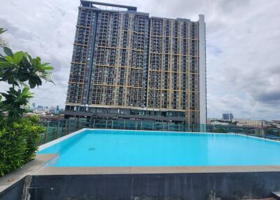 High-rise building with rooftop pool