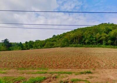 Empty plot of land with a view of a hill and sky