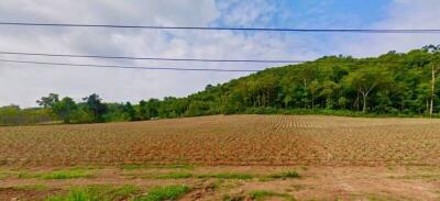 Empty plot of land with a view of a hill and sky