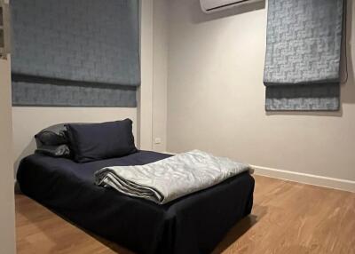 Cozy bedroom with wooden flooring