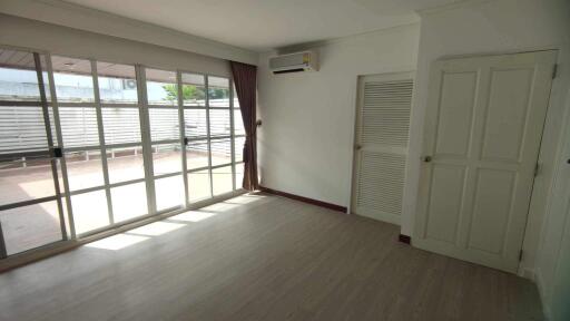 Living room with large windows and door to the patio