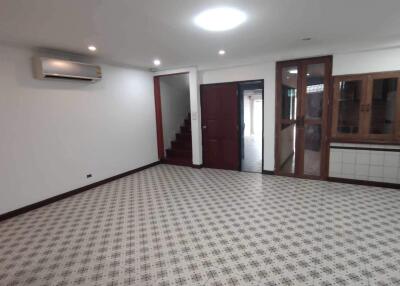 Spacious main living area with tiled flooring and air conditioning