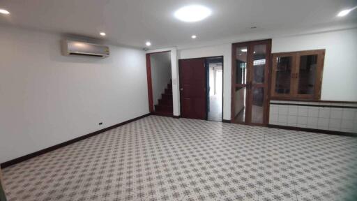 Spacious main living area with tiled flooring and air conditioning