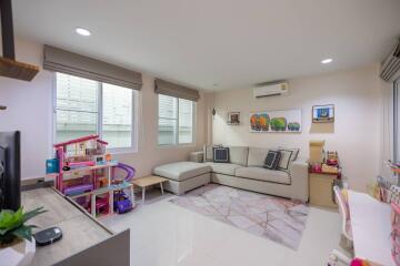 Bright and modern living room with children