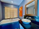 Stylish bathroom with a large jacuzzi tub, modern sink, and bright wall art