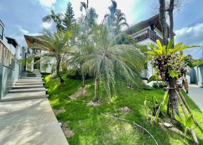 Exterior view of the property with lush greenery