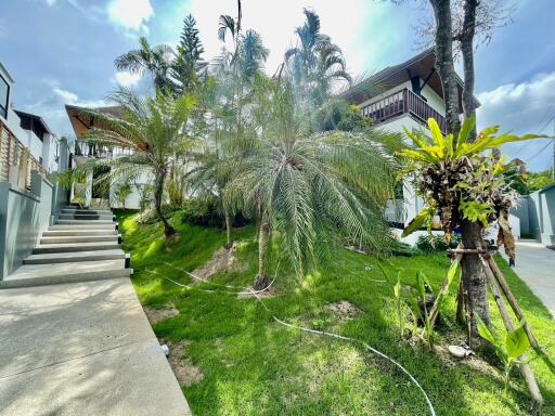 Exterior view of the property with lush greenery