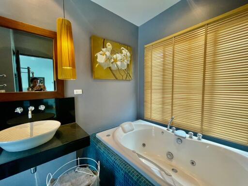 Modern bathroom with jacuzzi and stylish decor