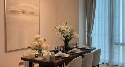 Elegant dining room with a set dining table and floral centerpiece