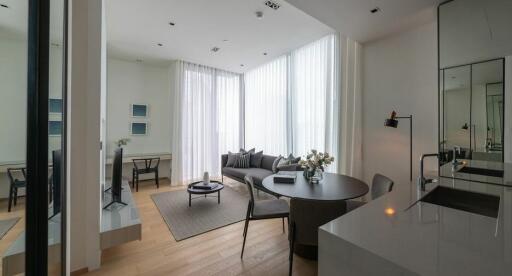 Modern living room with large windows and natural light