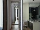 View of a modern open-plan kitchen and living space with dining area and hallway