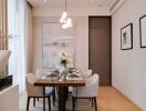 Modern dining room with a rectangular table set for six people, decorated with a central flower arrangement and wall art.