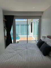 Modern bedroom with poolside view