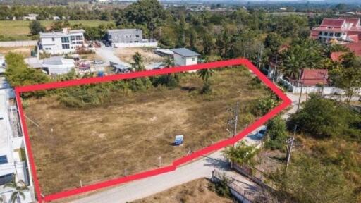 Aerial view of a vacant land plot surrounded by a red border