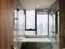 Modern bathroom with large window and city view