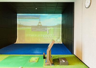 High-end golf simulator room with projection screen