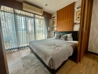 Cozy bedroom with a large bed and natural lighting