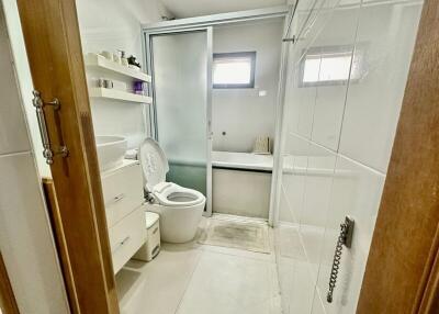 Modern bathroom with transparent sliding door