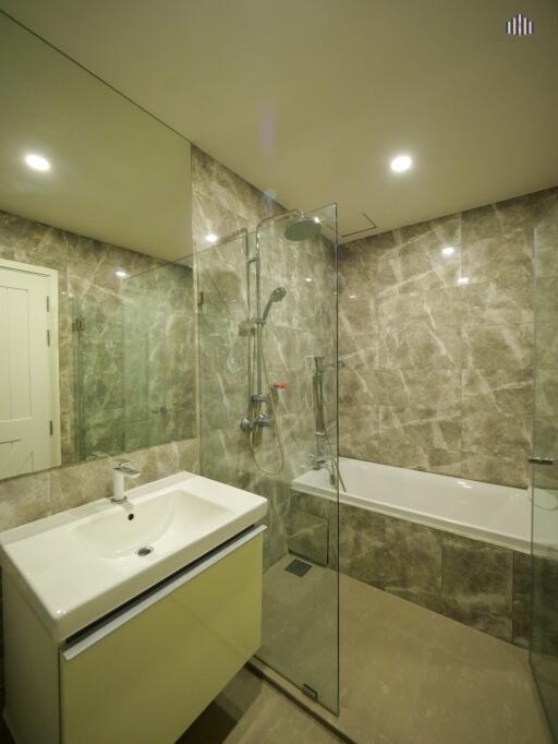 Modern bathroom with glass shower and bathtub