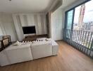 Modern living room with balcony and city view