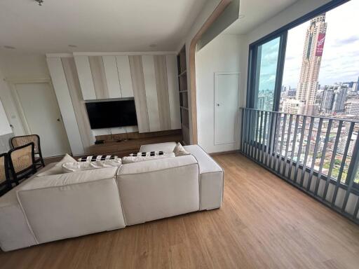 Modern living room with balcony and city view