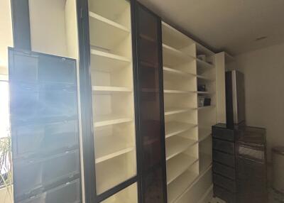 Spacious built-in storage with shelving