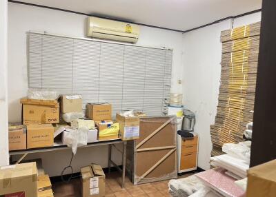 Room used for storage with boxes and packing materials